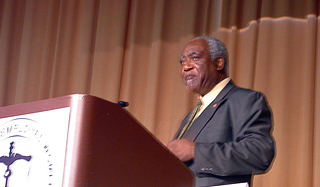 Rep. Danny Davis (D-7-IL) addresses attendees at a legislative breakfast arranged by Eye on Washington.